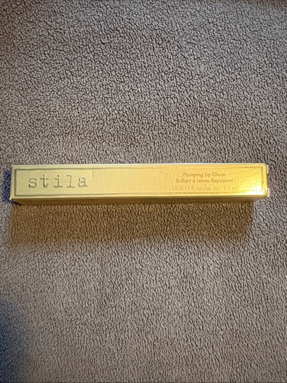 Stila Gold Plumping Lip Glaze in Metallic Gold Packaging